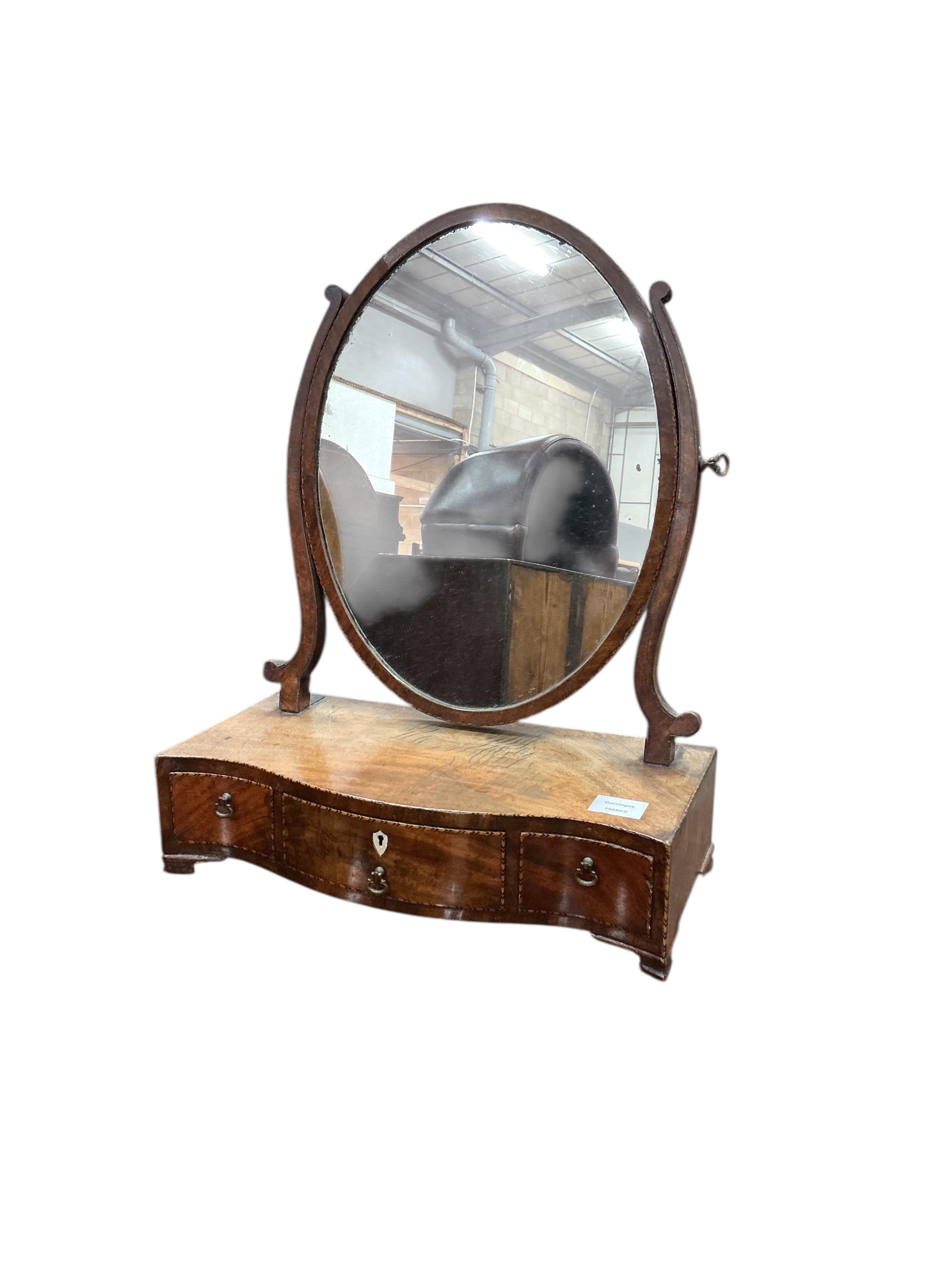 A George III toilet mirror in oval boxwood inlaid mahogany frame and one other, larger width 45cm, height 56cm